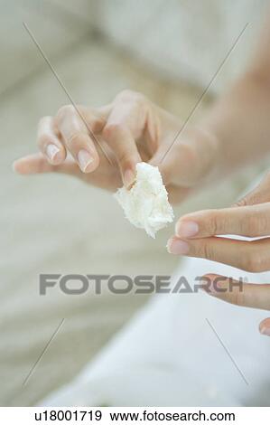 Close-up of a young woman holding bread View Large Photo Image Stock Photo - Close-up of a young woman holding bread. Fotosearch