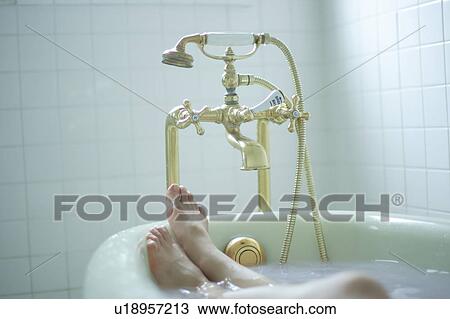 Woman's legs in bathtub View Large Photo Image Stock Image - Woman's legs in bathtub. Fotosearch