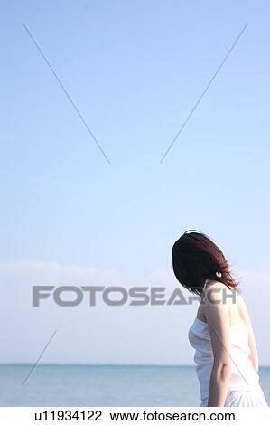 A young woman at beach View Large Photo Image Stock Image - A young woman at beach. Fotosearch