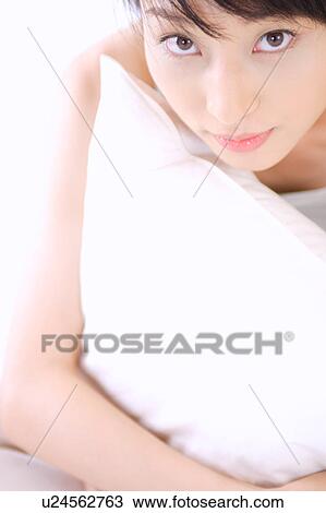 Portrait of a young woman, close-up View Large Photo Image Stock Image - Portrait of a young woman, close-up. Fotosearch