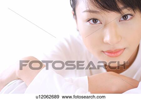 Portrait of a young woman, close-up View Large Photo Image Stock Photo - Portrait of a young woman, close-up. Fotosearch