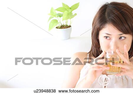 Portrait of a young woman, close-up View Large Photo Image Stock Photo - Portrait of a young woman, close-up. Fotosearch