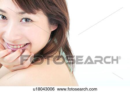 Stock Photograph - Portrait of a young woman, close-up. Fotosearch