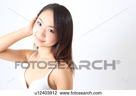 Stock Image - Portrait of a young woman in bikini. Fotosearch