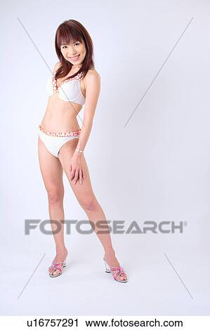 Portrait of a young woman in bikini View Large Photo Image Stock Image - Portrait of a young woman in bikini. Fotosearch