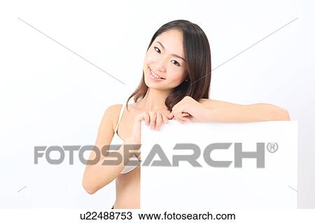Portrait of a young woman in bikini with blank message View Large Photo Image Stock Image - Portrait of a young woman in bikini with blank message. Fotosearch