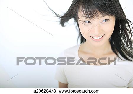 Stock Image - Portrait of a young woman. Fotosearch
