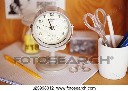 Clock and stationery View Large Photo Image Stock Image - Clock and stationery. Fotosearch