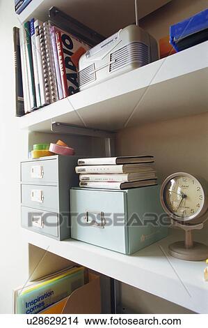 Picture - Clock on shelf. Fotosearch