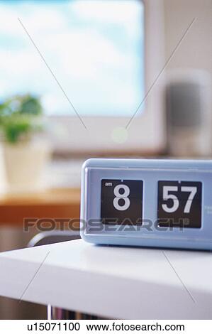 Stock Image - Clock on table. Fotosearch