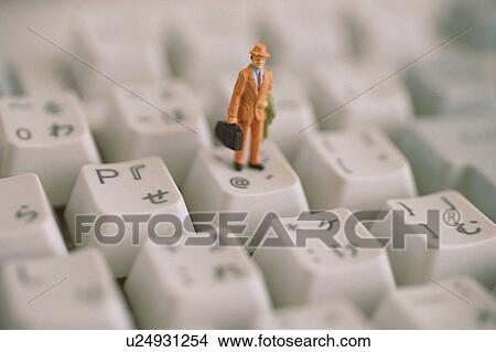 Figurine on keyboard View Large Photo Image Picture - Figurine on keyboard. Fotosearch