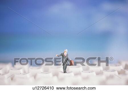 Stock Image - Figurine on keyboard. Fotosearch