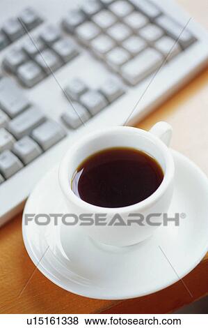 Stock Photo - Keyboard and cup of coffee. Fotosearch