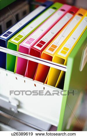 Multi colored files in drawer View Large Photo Image Stock Photo - Multi colored files in drawer. Fotosearch