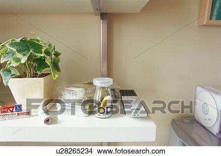 Potted plant and stickers in jar View Large Photo Image Picture - Potted plant and stickers in jar. Fotosearch