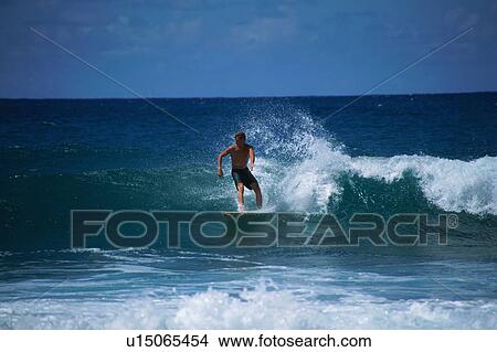 A young man surfing View Large Photo Image Picture - A young man surfing. Fotosearch