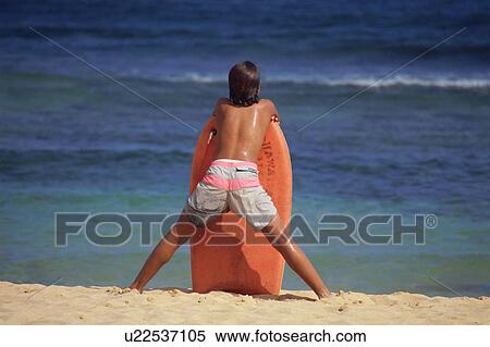 Boy looking at sea with body board View Large Photo Image Stock Photography - Boy looking at sea with body board. Fotosearch