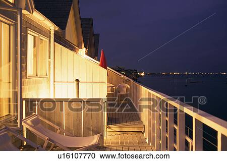 Chairs in illuminated terrace View Large Photo Image Stock Image - Chairs in illuminated terrace. Fotosearch