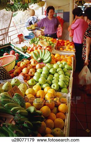 Mature adult woman selling fruit View Large Photo Image Stock Photo - Mature adult woman selling fruit. Fotosearch