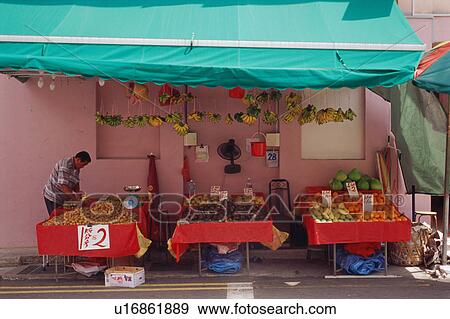 Mature man selling fruit View Large Photo Image Stock Photo - Mature man selling fruit. Fotosearch