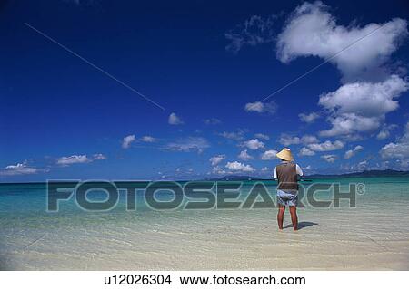 Picture - Mid adult man fishing. Fotosearch