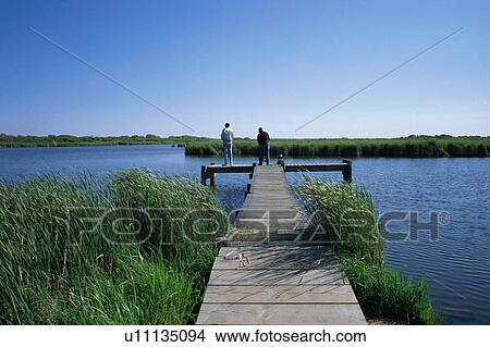 Two men fishing View Large Photo Image Picture - Two men fishing . Fotosearch