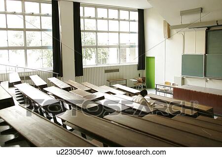 Stock Photo - College student studying in lecture hall. Fotosearch
