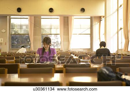 College student studying in library View Large Photo Image Picture - College student studying in library. Fotosearch