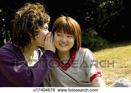 Two college students talking View Large Photo Image Stock Photo - Two college students talking. Fotosearch