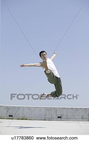 Young man dancing View Large Photo Image Stock Image - Young man dancing. Fotosearch