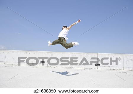 Stock Image - Young man dancing. Fotosearch
