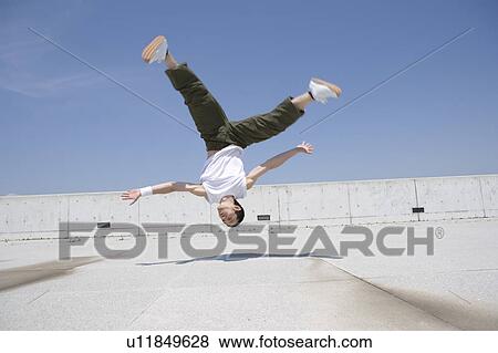 Young man dancing View Large Photo Image Stock Photo - Young man dancing. Fotosearch