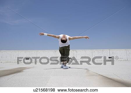 Young man exercising View Large Photo Image Stock Photo - Young man exercising. Fotosearch