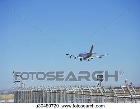 Airplane taking off View Large Photo Image Stock Image - Airplane taking off. Fotosearch