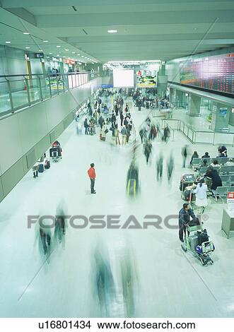 Picture - Busy airport terminal, blurred motion. Fotosearch