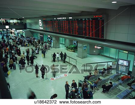 Busy airport terminal, blurred motion View Large Photo Image Stock Image - Busy airport terminal, blurred motion. Fotosearch