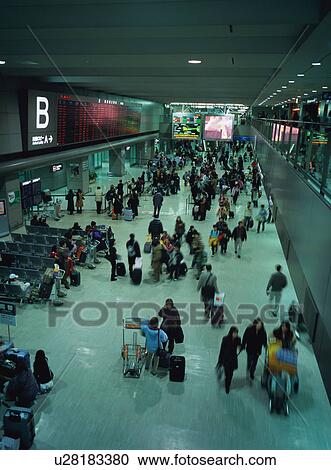 Busy airport terminal, blurred motion View Large Photo Image Stock Image - Busy airport terminal, blurred motion. Fotosearch