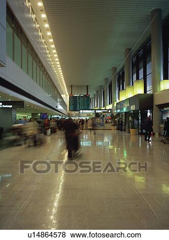 Stock Photo - Busy airport terminal, blurred motion. Fotosearch