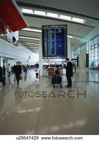 Busy airport terminal View Large Photo Image Stock Photo - Busy airport terminal. Fotosearch