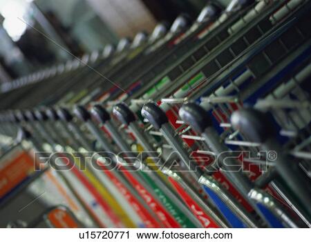 Row of luggage carts at airport terminal View Large Photo Image Stock Image - Row of luggage carts at airport terminal. Fotosearch