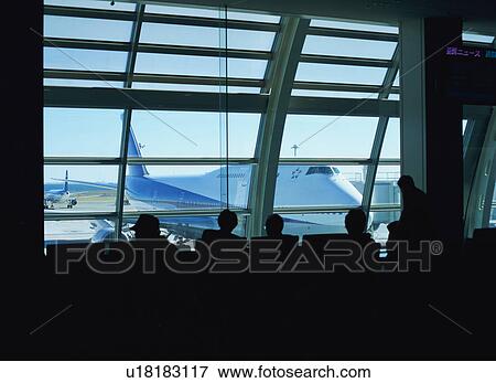 Travelers waiting to board airplane View Large Photo Image Stock Photo - Travelers waiting to board airplane. Fotosearch