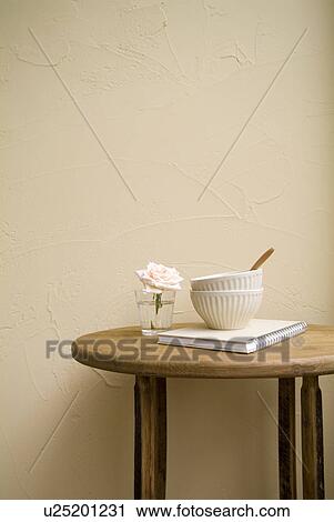 Bowls and flower on table View Large Photo Image Stock Image - Bowls and flower on table. Fotosearch
