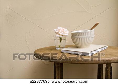 Bowls and flower on table View Large Photo Image Stock Photography - Bowls and flower on table. Fotosearch