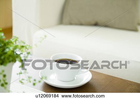 Coffee cup on table View Large Photo Image Picture - Coffee cup on table. Fotosearch