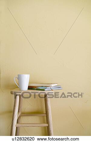 Mug and books on stool View Large Photo Image Stock Image - Mug and books on stool. Fotosearch