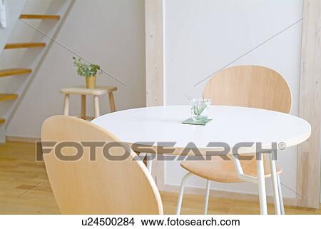 Picture - Table and two chairs. Fotosearch