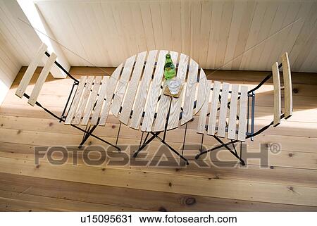 Stock Image - Table and two chairs. Fotosearch