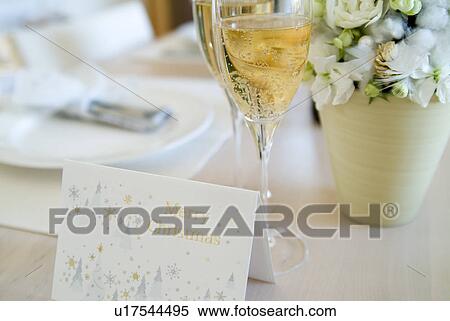 Christmas card and glasses of champagne View Large Photo Image Stock Photography - Christmas card and glasses of champagne. Fotosearch