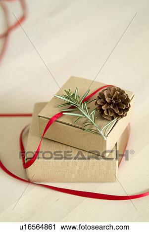 Christmas present and pine cone View Large Photo Image Stock Image - Christmas present and pine cone. Fotosearch