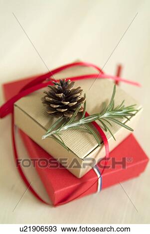 Christmas present and pine cone View Large Photo Image Stock Image - Christmas present and pine cone. Fotosearch